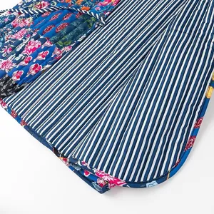 Close-up of quilted floral and striped pattern fabric on a fashionable women's vest.