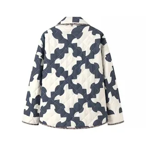 Back view of a women's quilted kimono jacket with a blue geometric print pattern