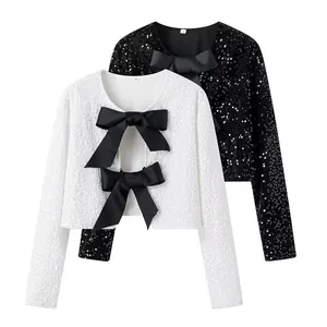 Elegant sequined bolero crop jackets in black and white featuring large black satin bows