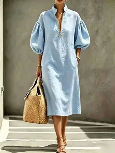 Light blue loose puff sleeve midi dress with gold zipper neckline detail for summer