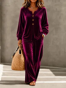Casual women's burgundy velvet two-piece set with V-neck button top and wide pants.