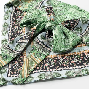 Close-up detail of bohemian paisley print halter top showing the large front bow knot