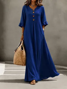 Elegant royal blue V-neck maxi dress with decorative buttons and ruffled sleeves