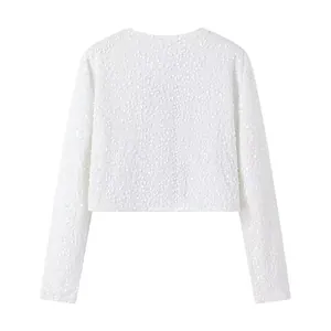 Detailed back view of an elegant white long-sleeve cropped jacket with sparkling sequins