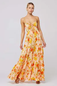 Full-length Bohemian floral maxi dress featuring cut-out tie bust and tiered skirt