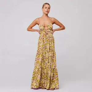 Floral print bohemian maxi dress with spaghetti straps and tie-front cutout detail