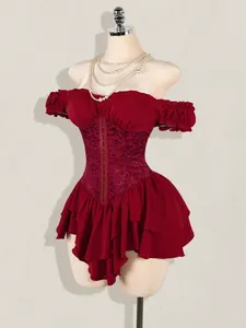 Detailed view of wine red jacquard corset dress with ruffled layers and off-shoulder