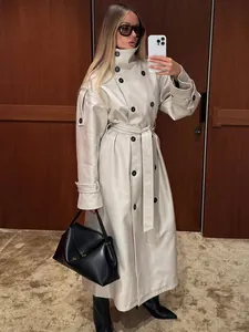 Elegant double-breasted long trench coat for women in chic off-white faux leather