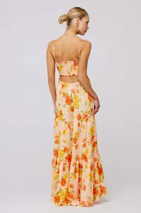 Elegant back view of bohemian floral print maxi dress featuring cutout and smocked details
