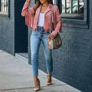 Chic pink suede fringe jacket for women shown in an outdoor street fashion setting