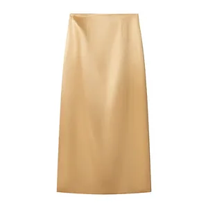 Detail view of an elegant champagne gold satin midi skirt with a luxurious silky finish.