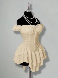 Detail of an off-the-shoulder jacquard tiered ruffled chiffon mini dress on a mannequin