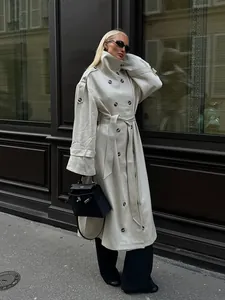 Elegant beige British style double-breasted long trench coat with waist belt street view