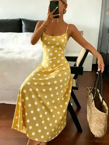Elegant yellow polka dot maxi dress featuring camisole straps and a slim silhouette design