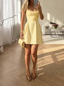 Chic yellow sleeveless mini dress with floral jacquard texture and square neckline