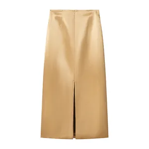Detailed back view of a champagne gold satin midi skirt with a slit and zipper.