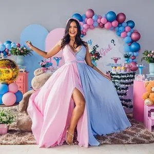 Detailed view of pink and blue spliced maternity gown for gender reveal photography