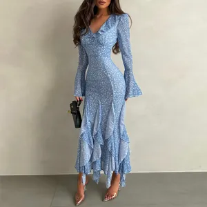 Detailed view of a light blue floral print midi dress featuring ruffles and bell sleeves