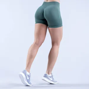 Detailed view of the butt-lifting texture on these green seamless yoga shorts.