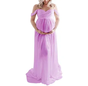 Detailed view of elegant off-the-shoulder pink chiffon maternity photography gown