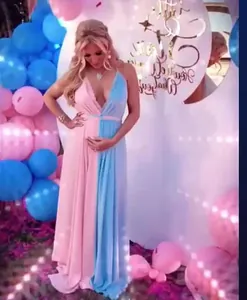Close-up of pink and blue spliced V-neck mesh maternity maxi dress for photography
