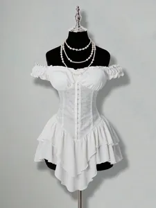 Detail view of white jacquard corset on ruffled off-shoulder layered chiffon mini dress