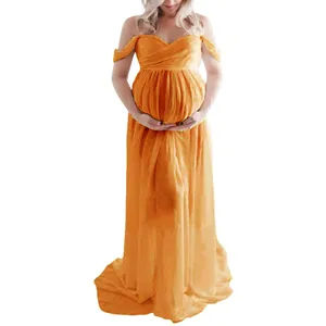 Detail view of off-shoulder maternity photoshoot dress with split front and floor length