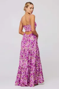 Back view of purple floral bohemian maxi dress with smocked bodice and cut-out detail