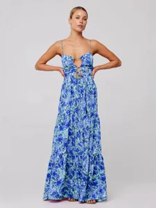 Bohemian floral print spaghetti strap maxi dress with cutout front and tiered skirt.