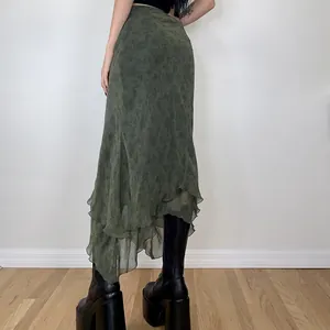 Detailed back view of a dark green chiffon long skirt featuring an irregular tiered ruffled hem