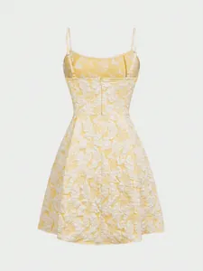 Detailed back view of a yellow floral jacquard mini dress with a hidden zipper closure.