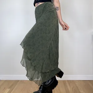 Detail view of olive green floral chiffon maxi skirt with layered irregular hem