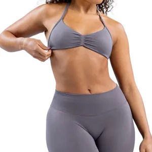 Seamless high-stretch grey yoga set with halter sports bra and high-waisted leggings