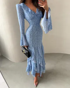 Detailed view of light blue floral dress with ruffle collar and bell sleeves