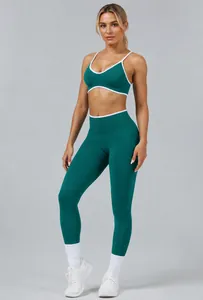 Teal sports bra and high-waisted yoga leggings set shown on a fitness model