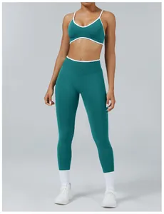 Professional teal two-piece yoga set featuring strappy sports bra and high-waisted leggings
