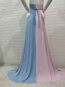 Back view of a pink and blue split-color maternity gown with elegant long train detail