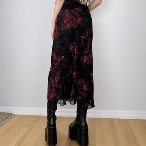 Vintage black midi skirt with red floral print for a bohemian look