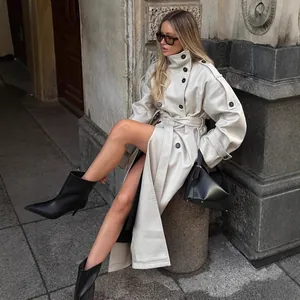 Stylish double-breasted off-white long trench coat for women in British urban lifestyle