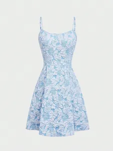 Detail of a sleeveless blue mini dress featuring 3D white floral embroidery.