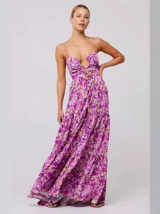 Bohemian purple floral print maxi dress with spaghetti straps and front cut-out detail