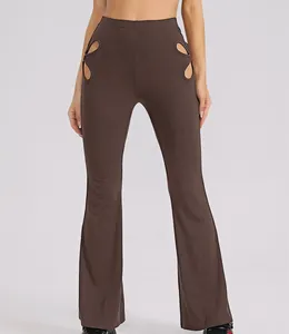 Close-up detail of brown ribbed flared pants featuring high-waist design and hip cut-outs