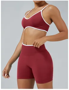 Close-up detail of red and white seamless sports bra and high-waisted fitness shorts set