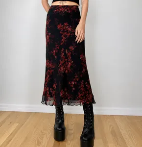 Vintage style black high waist midi skirt featuring red floral print and ruffled hem
