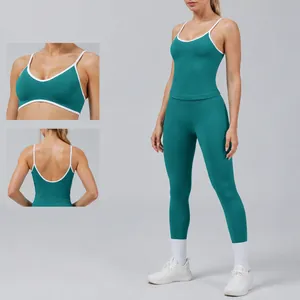 Seamless teal green yoga set for women featuring contrast binding and U-shaped back
