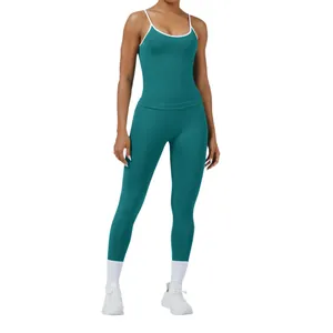 Two-piece seamless yoga set in teal featuring spaghetti strap top and high-waist leggings
