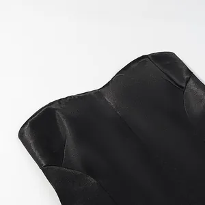 High-quality detail shot showing the shiny texture of the black satin blazer set