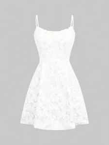 Close-up of white 3D floral embroidery and lace texture on a sleeveless mini dress