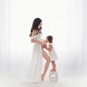 Elegant white off-shoulder maternity photoshoot dress with front split and long train