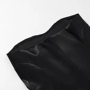 Detailed macro view of the black elegant mermaid skirt set with textured coated fabric.